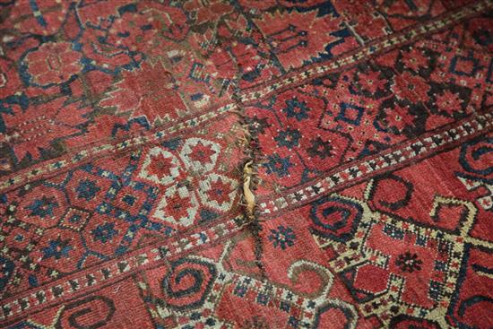 A large Persian carpet, 20ft 8in by 8ft 6in.